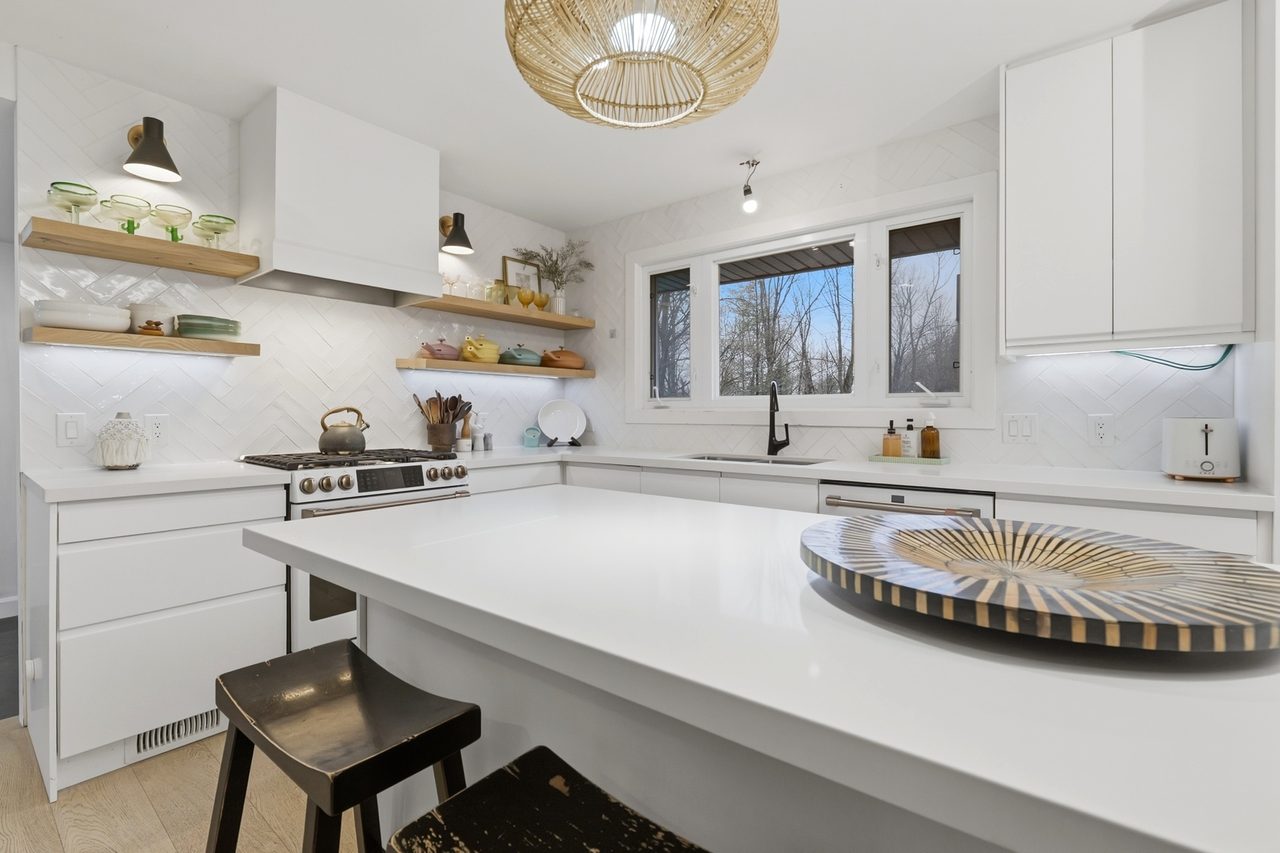 Kitchen with window seat and custom cabinetry by Koenig Painting and Design